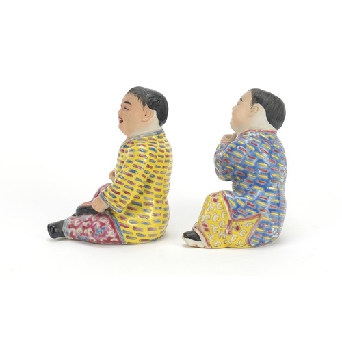 335 - Pair of Chinese hand painted porcelain figures of children, the largest 10cm high