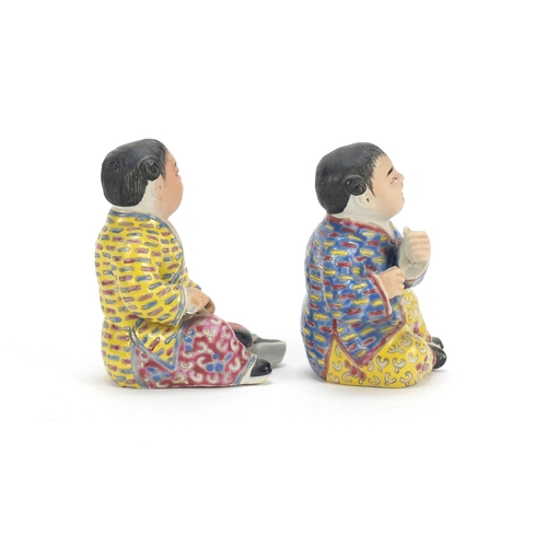 335 - Pair of Chinese hand painted porcelain figures of children, the largest 10cm high