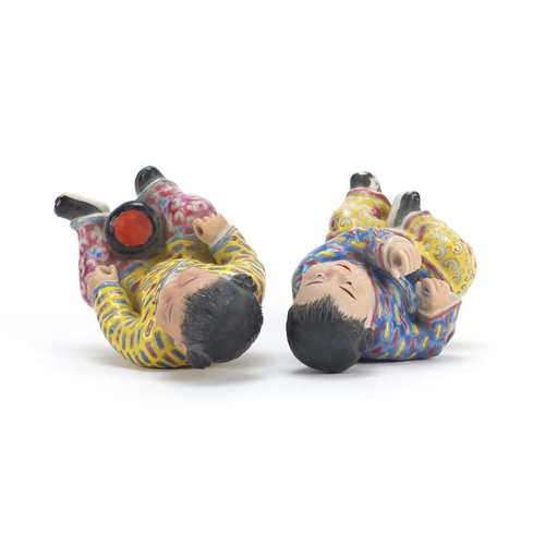 335 - Pair of Chinese hand painted porcelain figures of children, the largest 10cm high