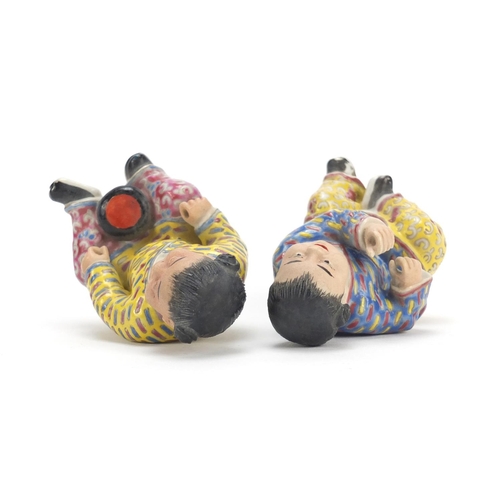 335 - Pair of Chinese hand painted porcelain figures of children, the largest 10cm high