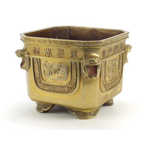 379 - Chinese bronze planter with lion head handles, finely cast panels of animals and calligraphy, charac... 