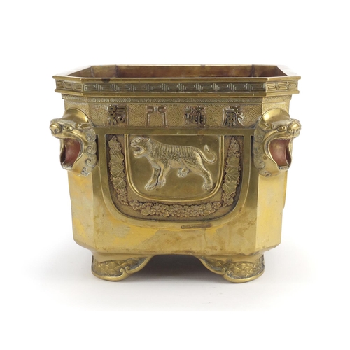 379 - Chinese bronze planter with lion head handles, finely cast panels of animals and calligraphy, charac... 