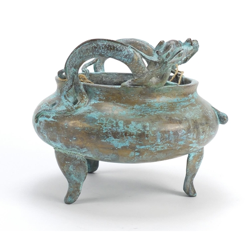 382 - Chinese bronze tripod incense burner with twin handles, character marks to the base, 15.5cm high x 1... 