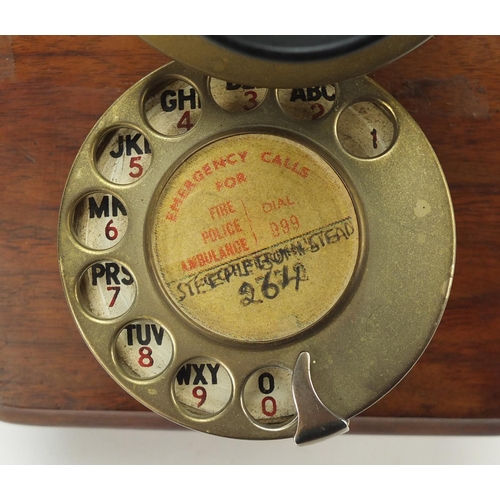 68 - Vintage oak and brass wall telephone, 24.5cm high