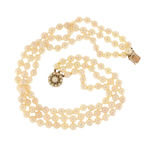 701 - Three string pearl necklace with 9ct gold clasp, 36cm in length, 90.0g