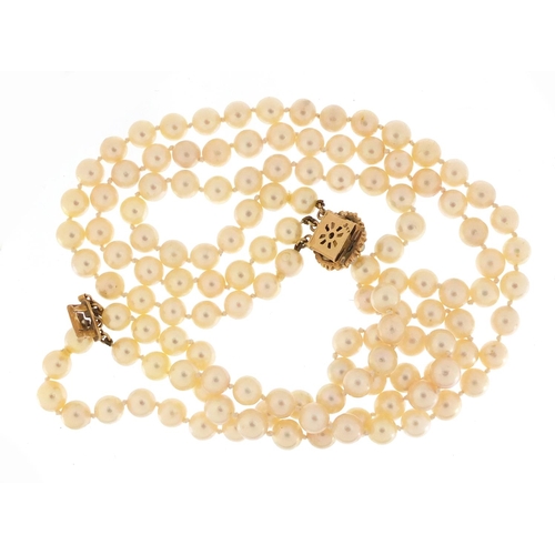 701 - Three string pearl necklace with 9ct gold clasp, 36cm in length, 90.0g