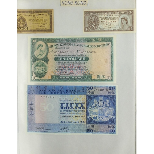 203 - Album of world bank notes arranged in an album including China, Austria, Cambodia and Germany