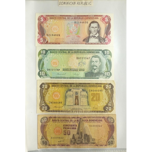 203 - Album of world bank notes arranged in an album including China, Austria, Cambodia and Germany