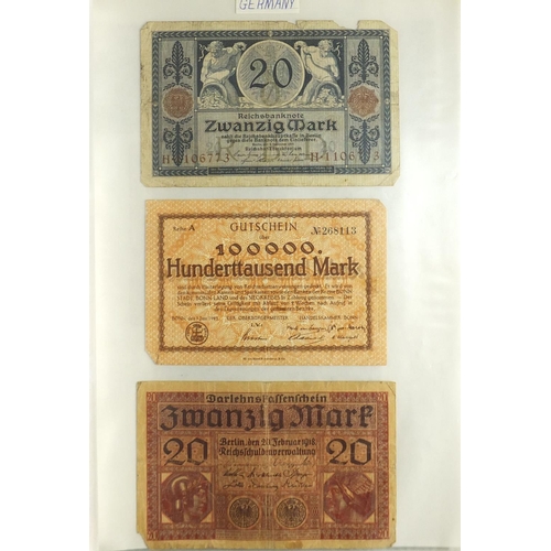 203 - Album of world bank notes arranged in an album including China, Austria, Cambodia and Germany