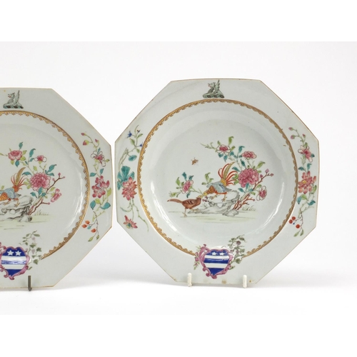 307 - Two Chinese porcelain armorial plates and a soup bowl, each finely hand painted in the famille rose ... 