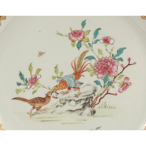 307 - Two Chinese porcelain armorial plates and a soup bowl, each finely hand painted in the famille rose ... 