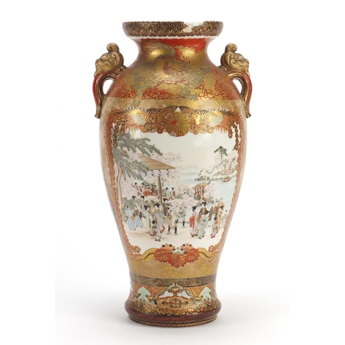 396 - Japanese Kutani porcelain vase with twin handles, finely hand painted with figures parading, charact... 