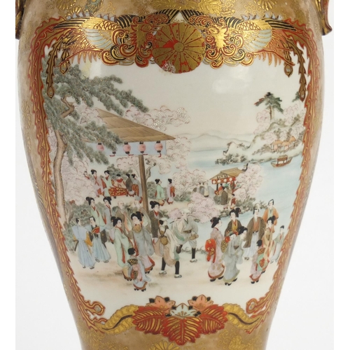 396 - Japanese Kutani porcelain vase with twin handles, finely hand painted with figures parading, charact... 