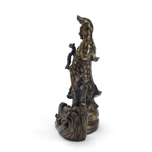 377 - Chinese porcelain figure of Guanyin and a child, 24.5cm high