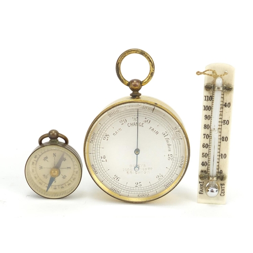18 - Brass cased pocket barometer by Dixeys, with fitted case and unassociated compass, 9.5cm high