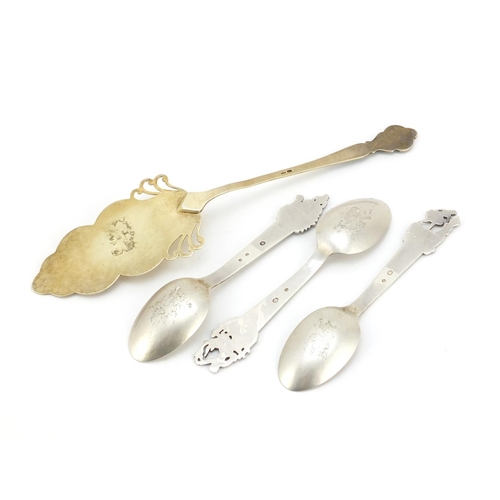 624 - Three Danish silver spoons and a silver gilt cake slice with enamelled handle, the spoons with JG ma... 