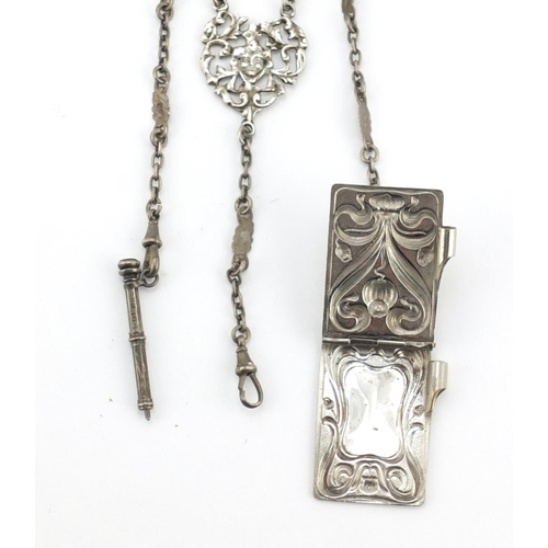 602 - Victorian silver chatelaine with vesta, stamp case, propelling pencil and aide-mémoire, the chatelai... 