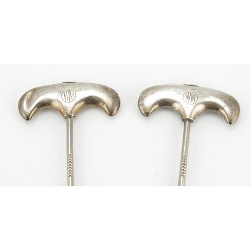 611 - Pair of Edawardian silver handled boot pulls, Birmingham 1916, 24.5cm in length