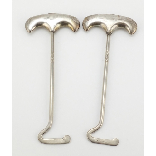 611 - Pair of Edawardian silver handled boot pulls, Birmingham 1916, 24.5cm in length