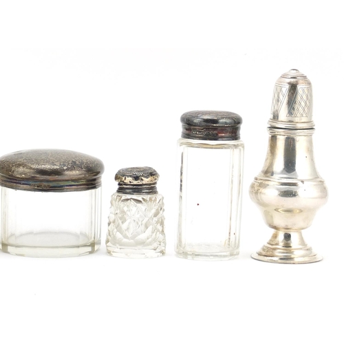 594 - Silver items including two baluster shaped casters, three cut glass jars with silver lids and a cut ... 