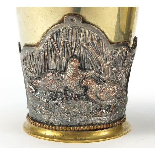 237 - Pair of silver plated and copper beakers, relief decorated with ducks and partridges, 12cm high