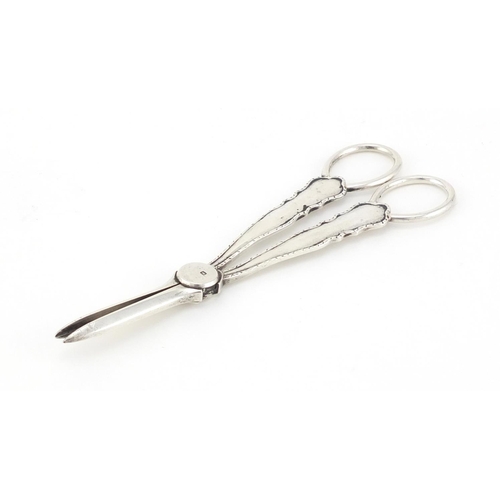 591 - Pair of silver grape scissors by William Hutton & Sons Ltd, Sheffield 1908, 15.5cm in length, 71.4g