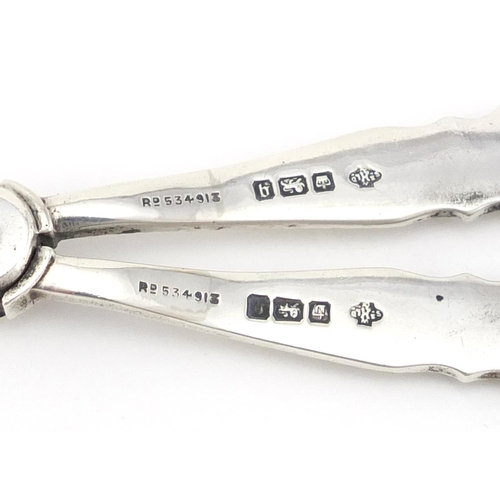 591 - Pair of silver grape scissors by William Hutton & Sons Ltd, Sheffield 1908, 15.5cm in length, 71.4g