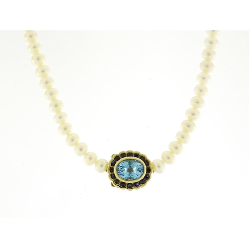 697 - Single string pearl necklace with 9ct gold blue stone and sapphire clasp, 44cm in length, 21.0g