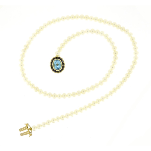 697 - Single string pearl necklace with 9ct gold blue stone and sapphire clasp, 44cm in length, 21.0g