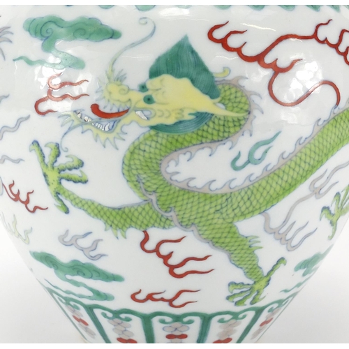 326 - Chinese porcelain Wucai vase, hand painted with two dragons chasing the flaming pearl amongst clouds... 