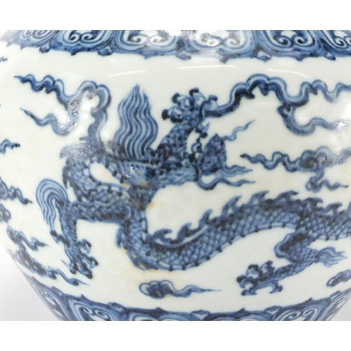 330 - Chinese blue and white porcelain jar, hand painted with dragons amongst clouds within rui head borde... 