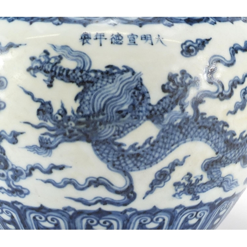 330 - Chinese blue and white porcelain jar, hand painted with dragons amongst clouds within rui head borde... 