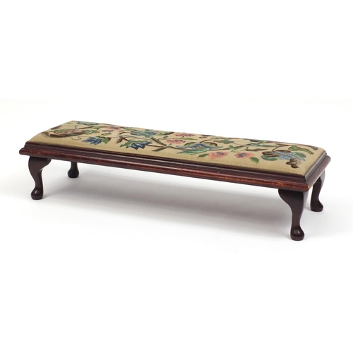 153 - Mahogany foot stool with tapestry seat, 96cm in length