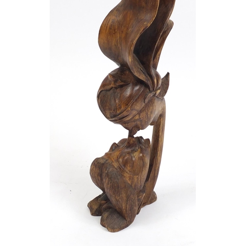 2048A - Floor standing carved wood sculpture of embracing figures, 83cm high