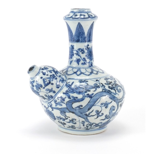 357 - Chinese blue and white porcelain Kendi, hand painted with two dragons amongst flower and foliage, 22... 