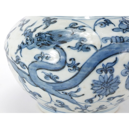 357 - Chinese blue and white porcelain Kendi, hand painted with two dragons amongst flower and foliage, 22... 