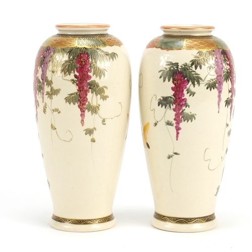 391 - Pair of Japanese Satsuma pottery vases hand painted with birds of paradise amongst wisteria, charact... 