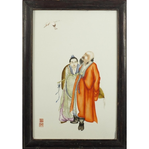 367 - Chinese porcelain panel housed in a hardwood frame, finely hand painted with two figures watching a ... 