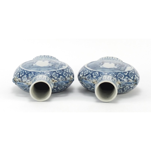 313 - Pair of Chinese blue and white porcelain moon flasks with twin handles, each hand painted with panel... 