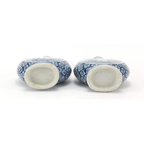 313 - Pair of Chinese blue and white porcelain moon flasks with twin handles, each hand painted with panel... 