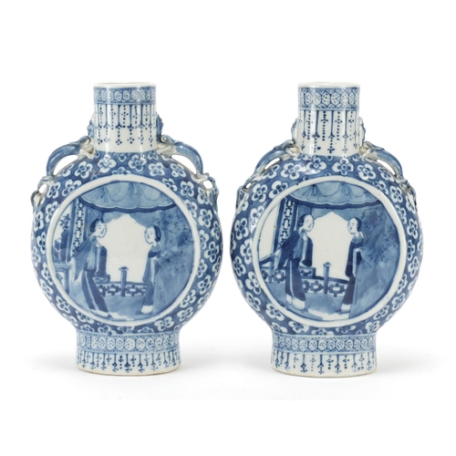 313 - Pair of Chinese blue and white porcelain moon flasks with twin handles, each hand painted with panel... 