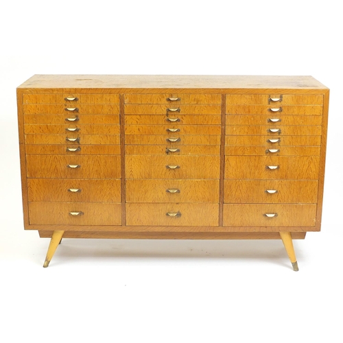 2007 - 1920's industrial oak multi drawer chest, with baize lined sectional drawers and brass handles, 99.5... 