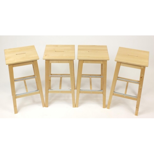 2029 - Set of four Ikea Bosse light wood breakfast stools, 74cm high