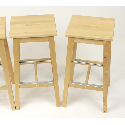 2029 - Set of four Ikea Bosse light wood breakfast stools, 74cm high