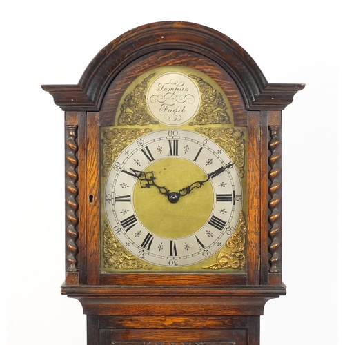 2024 - Tempus Fugit oak longcase clock, striking on eight rods, the ornate dial with silvered chapter ring,... 
