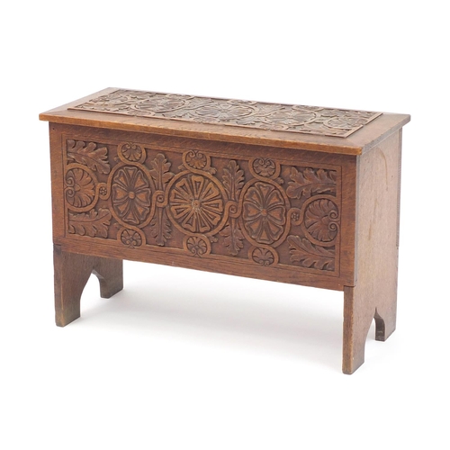 2049 - Carved oak blanket box with hinged lid, 43cm high x 64cm wide x 28cm deep