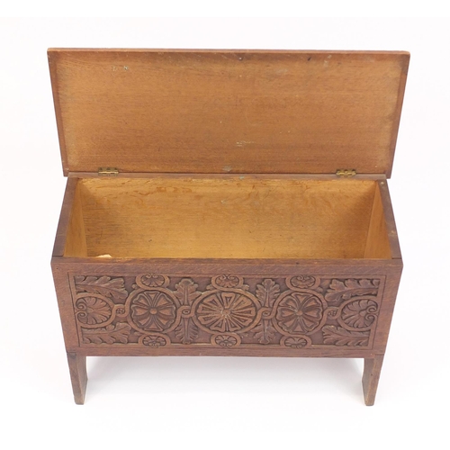 2049 - Carved oak blanket box with hinged lid, 43cm high x 64cm wide x 28cm deep