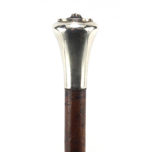 300 - Military interest swagger stick with silver pommel and Egyptian bust, 64.5cm in length