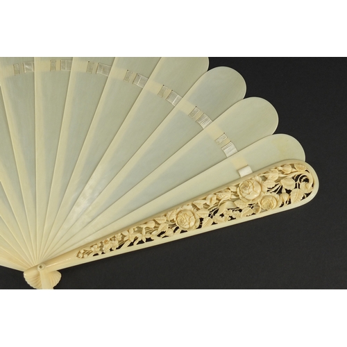 38 - Victorian ivory fan, the front guard finely carved and pierced with flowers and foliage, 20cm in len... 