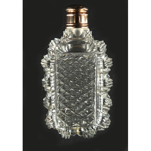 87 - Victorian cut glass scent bottle with unmarked gold lid, 7.5cm high